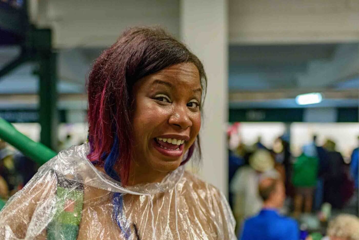 Soggy racing fans take shelter from the rain to make bets on the running of the 144th Kentucky Derby. May 5, 2018
