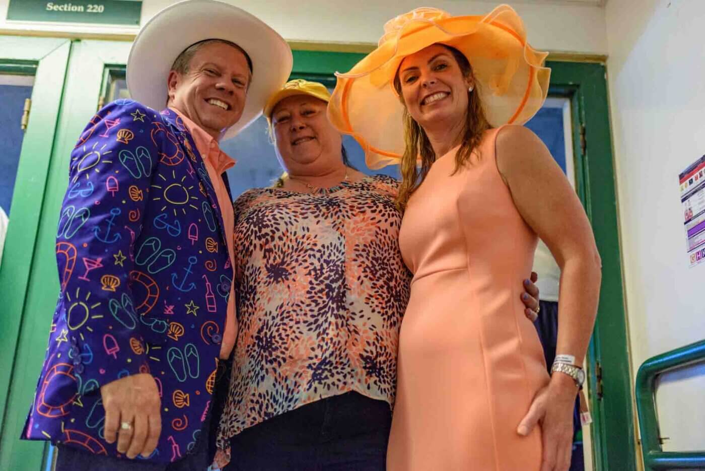 Soggy racing fans take shelter from the rain to make bets on the running of the 144th Kentucky Derby. May 5, 2018