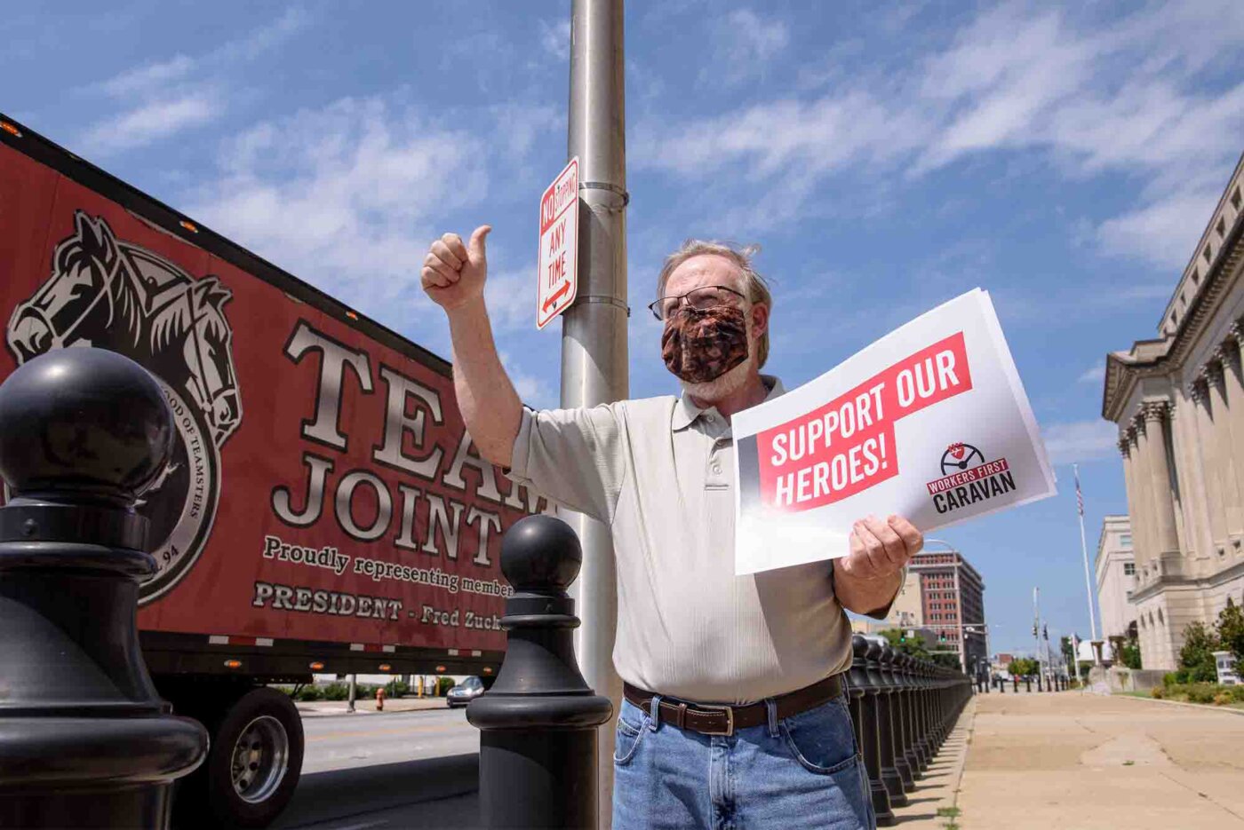Bill Londrigan, president of the Kentucky State AFL-CIO waves to a car caravan circling the office of Senate Majority Leader Mitch McConnell (R-KY) in the Gene Snyder U.S. Courthouse as unemployed activists, the KY AFL-CIO, the Center for Popular Democracy and partners mobilize as part of a national day of action to proclaim #MitchBetterHaveMyMoney and urge Congress to provide relief for all, Thursday, Aug. 6, 2020, in Louisville, Ky.