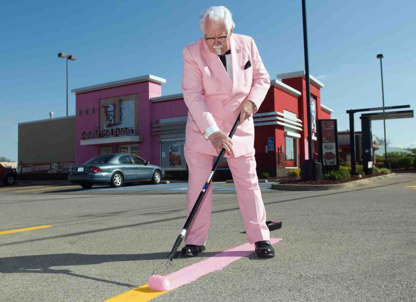The KFC Colonel Bob Thompson helps as a Louisville, Ky., KFC restaurant “goes pink” Friday, April 9, 2010, to help launch the brand’s new Buckets For a Cure™ campaign, aimed at raising both money and awareness for breast cancer. For the first time in the brand’s 70-year history, KFC’s iconic buckets will change color this month, along with their global “White House” headquarters, as part of a brand-wide pink makeover to support Susan G. Komen for the Cure®.