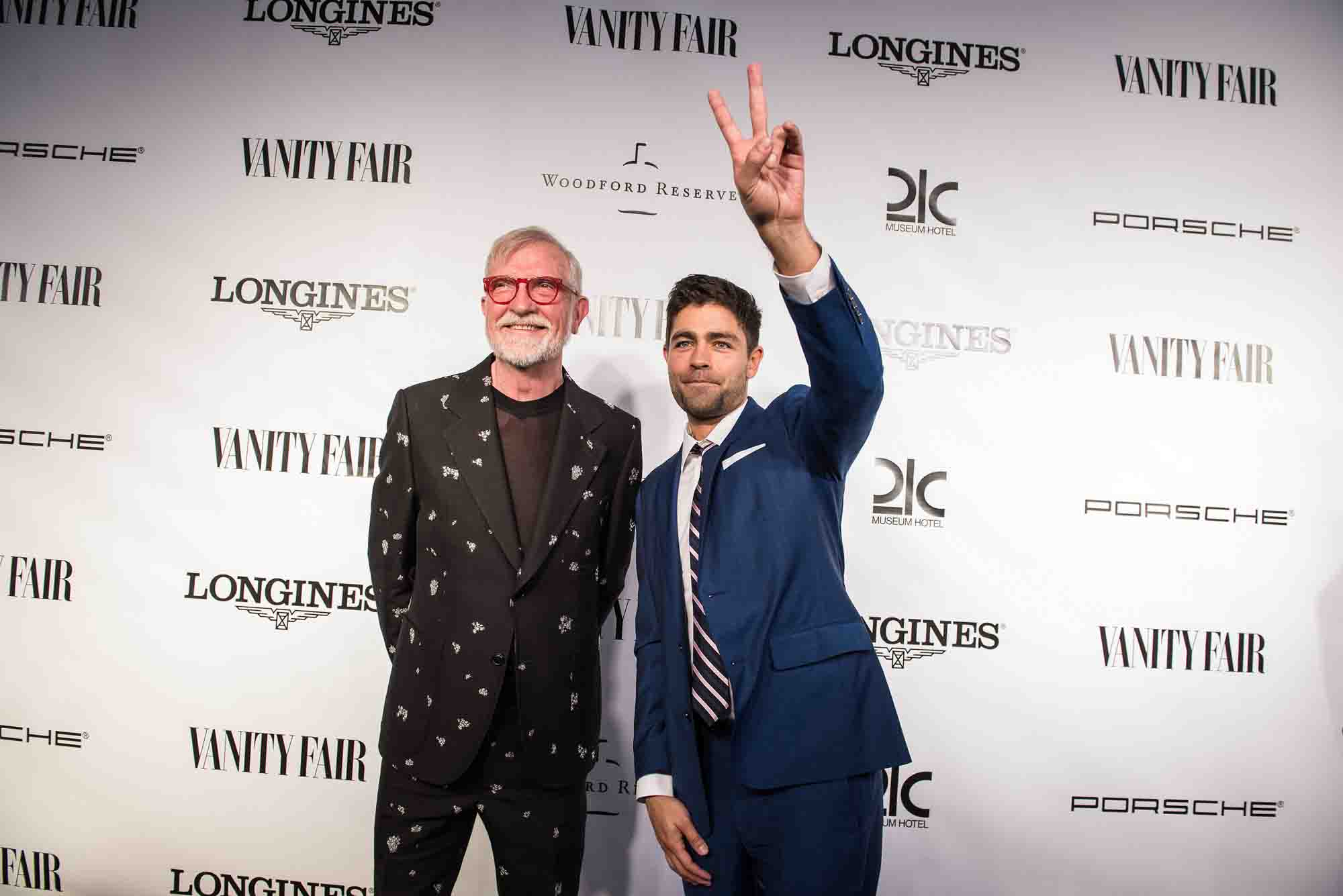 21c owner Steve Wilson and and his guest actor Adrian Grenier are seen on the black carpet at the Vanity Fair Derby party at 21c Museum Hotel. May 6, 2016